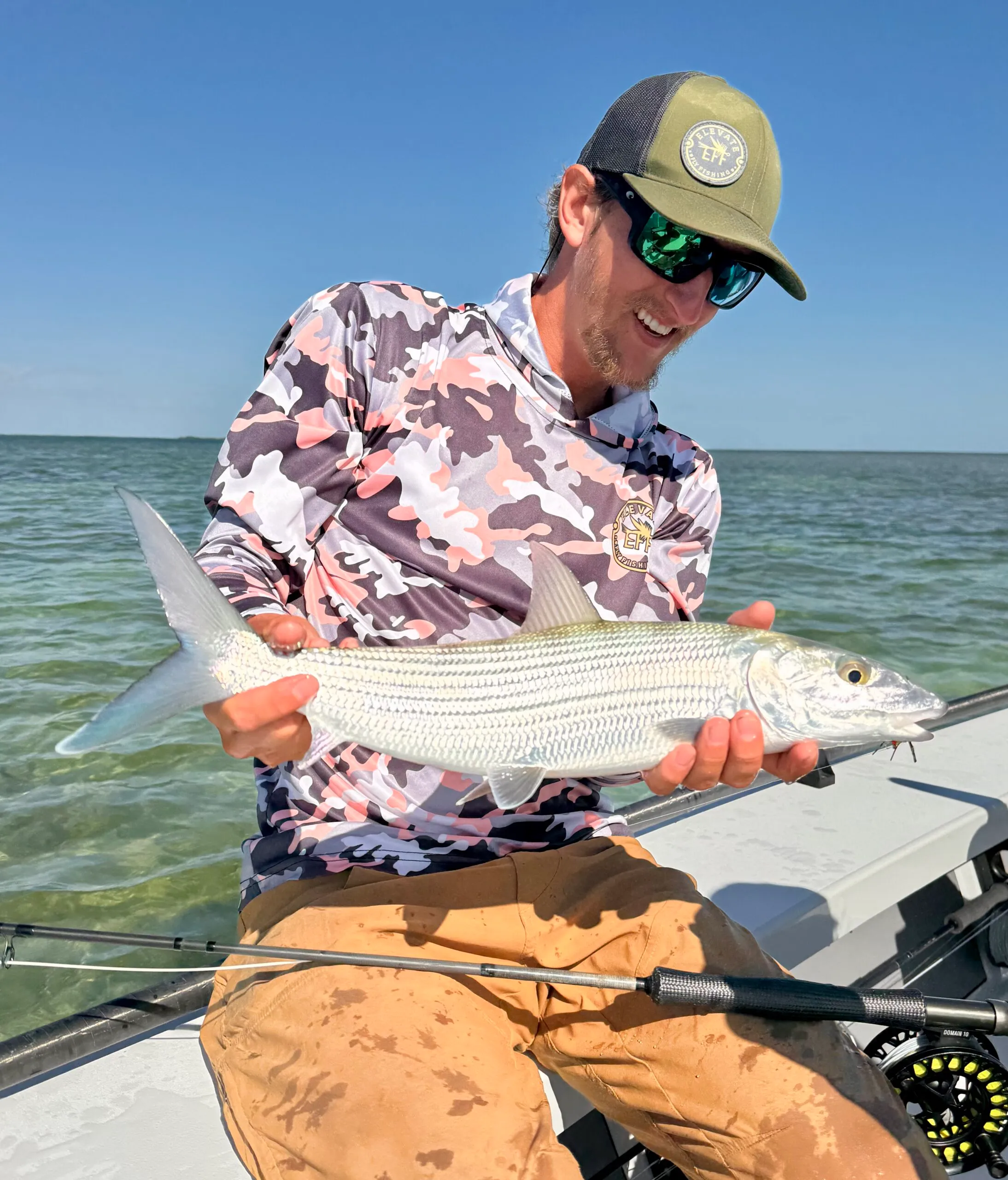 Angler holding a bonefish on the skiff in the Lower Keys